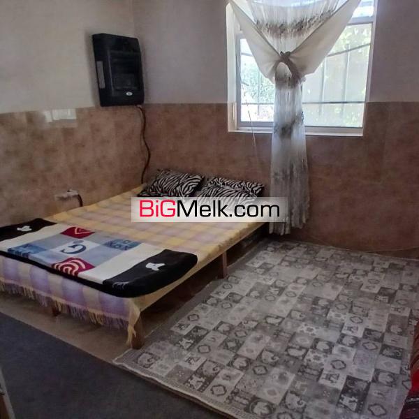 ۱۹۸۰ متر باغچه با ۱۴۰متر بنا آب برق گاز سند تک برگ رسمی